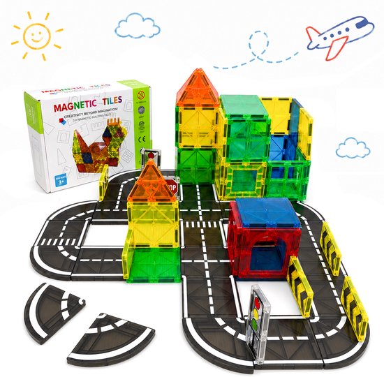 Magnetische bouwstenen in regenboogkleuren vormen gebouwen op een speelgoedweg met verkeerslichten en wegversperringen.