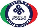 Rond logo met Italiaanse vlagkleuren en tekst: TESTED BY ITALIAN TASTERS.