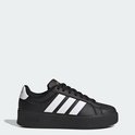 Zwarte damessneaker met platformzool en witte Adidas-strepen op de zijkant. Logo op de zool.