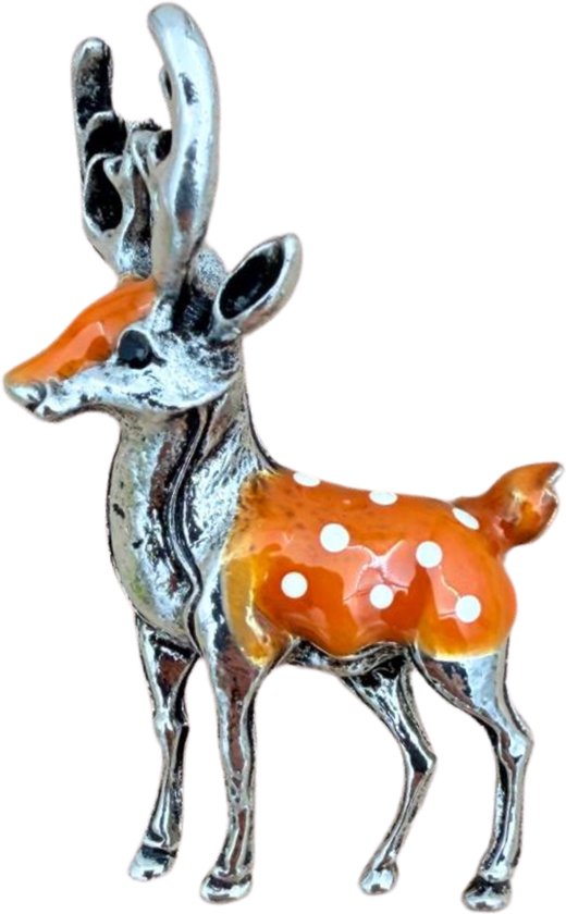 Broche de cerf dorée à pois blancs.