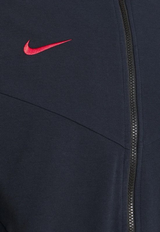 Donkerblauw Nike Tech vest met rode Nike logo en zwarte rits.
