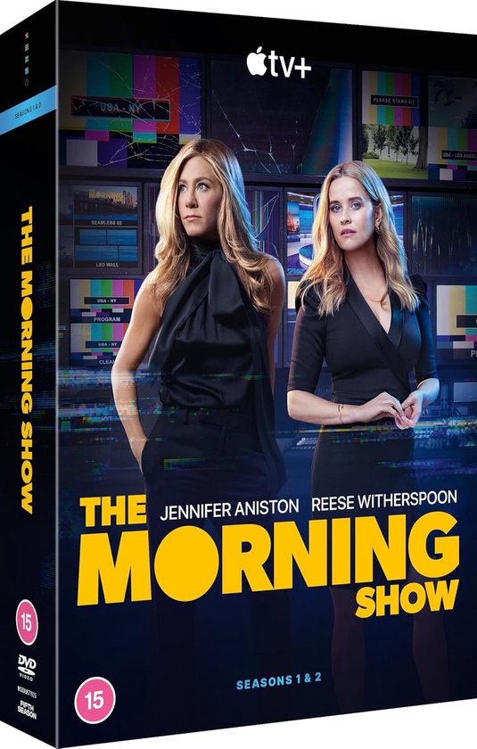 Jennifer Aniston en Reese Witherspoon poseren naast elkaar. "The Morning Show" staat groot in gele letters op de voorkant. De hoes is een DVD-hoes.