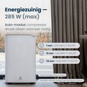 Witte Vibrix luchtontvochtiger met display '51' in een woonkamer. Beschrijft energiezuinig ontwerp en laag energieverbruik.