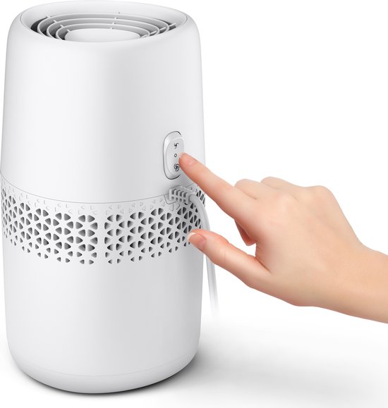 Un doigt appuie sur le bouton de commande d'un humidificateur d'air Philips blanc.