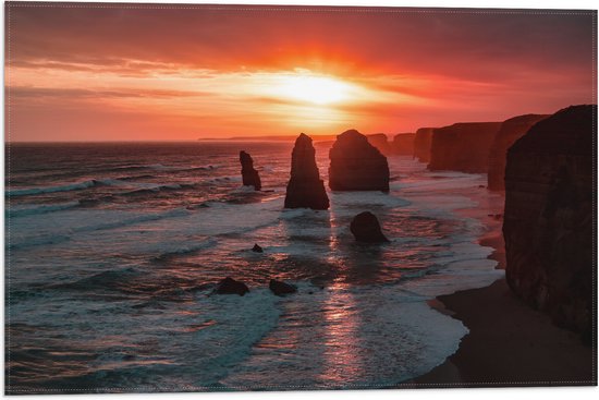 WallClassics - Vlag - Rotsen in de Zee met Zonsondergang - 60x40 cm Foto op Polyester Vlag