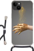 Geschikt voorApple Iphone 14 - Crossbody Case - Vrouw met goud geverfde handen en een wolk van glitters - Siliconen - Crossbody - Backcover met Koord - Telefoonhoesje met koord - Hoesje met touw