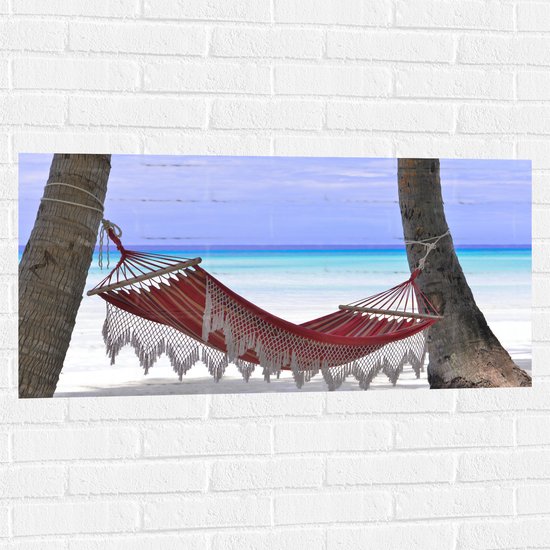 WallClassics - Muursticker - Hangmat op het Strand - 100x50 cm Foto op Muursticker