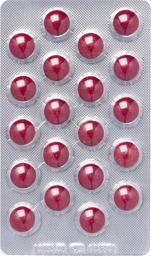 Blisterverpakking met 19 ronde, rode tabletten van Dagravit. Één tablet mist.