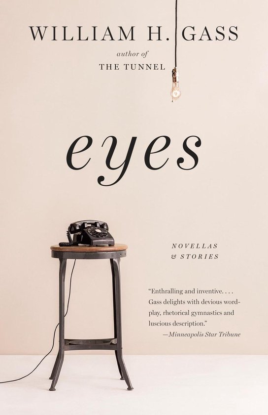Boek 'Eyes' van William H. Gass, met op een metalen statafel een zwarte telefoon. De titel is in grote, sierlijke letters geschreven.