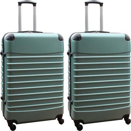 Twee mintgroene koffers met horizontale ribbels, een uitschuifbare handgreep en zwarte hoekbeschermers.
