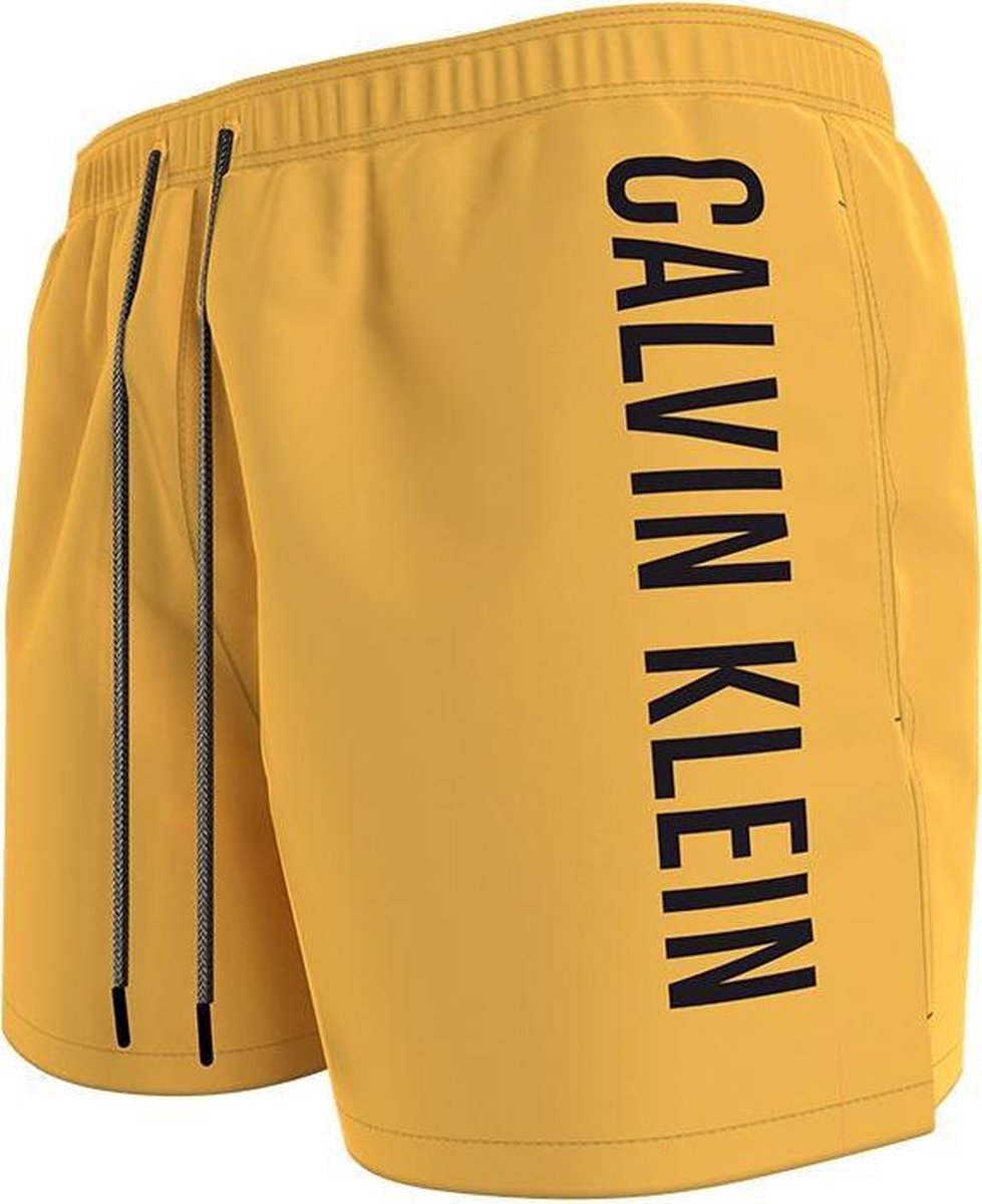 Bespaar 5% Heren Kleding voor voor Strandkleding voor Zwembroeken Calvin Klein Medium Drawstring Zwembroek in het Geel voor heren 