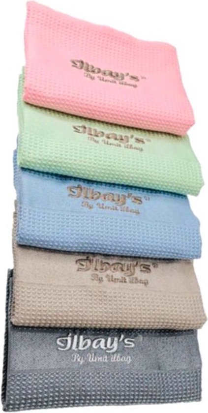 Cinq lingettes microfibre Jilbay's en rose, vert clair, bleu clair, beige et gris, empilées.