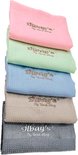 Cinq lingettes microfibre Jilbay's en rose, vert clair, bleu clair, beige et gris, empilées.