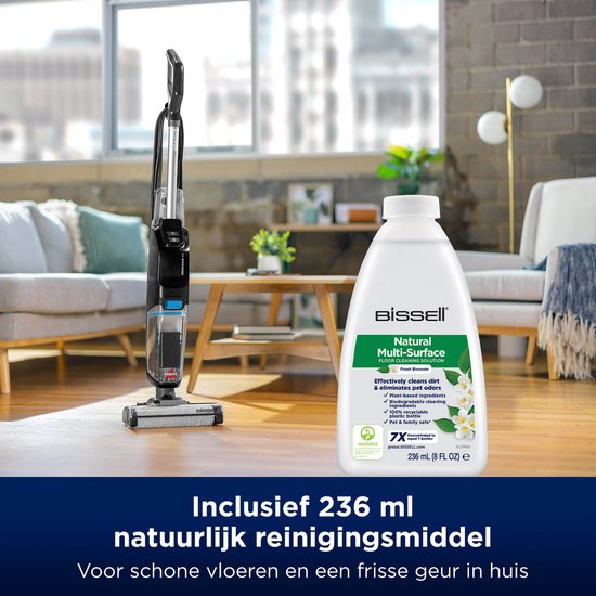 De BISSELL CrossWave staat in een woonkamer naast een fles van 236 ml natuurlijk reinigingsmiddel.