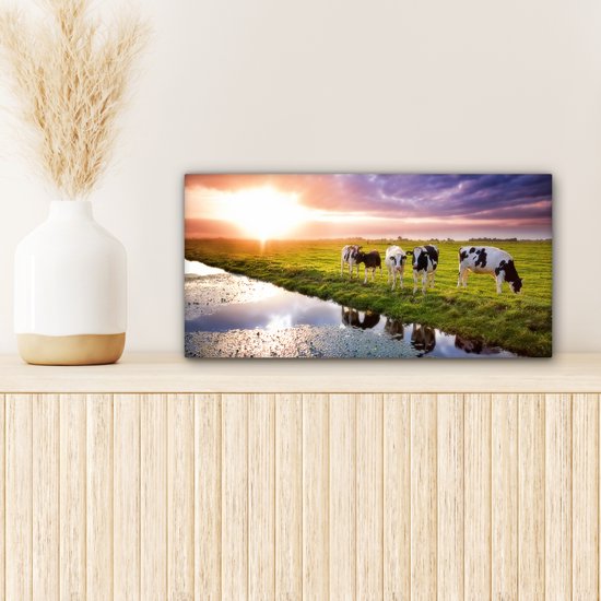 Tableau sur toile Vaches pendant un coucher de soleil - 40x20 cm - Décoration murale Art