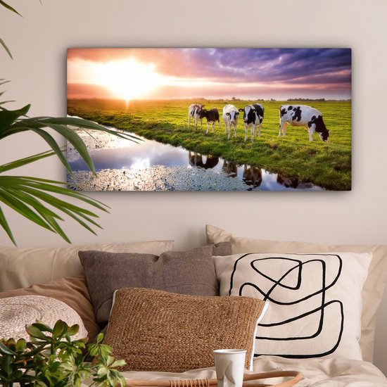 Tableau sur toile Vaches pendant un coucher de soleil - 80x40 cm - Décoration murale Art
