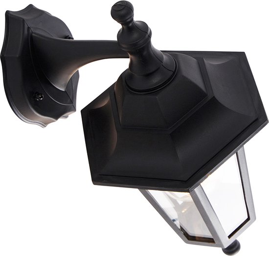 Gedetailleerd aanzicht van een klassieke zwarte wandlamp met glazen panelen.
