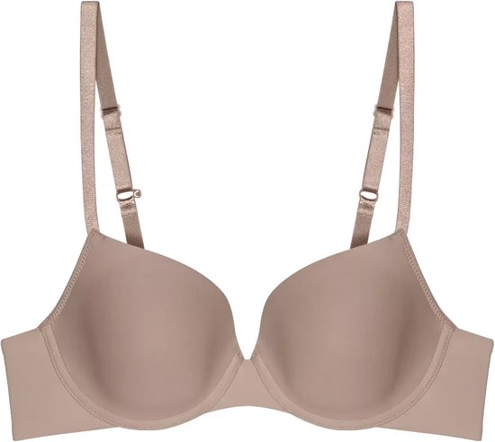 Nude push-up beha met voorgevormde cups en verstelbare bandjes op witte achtergrond.