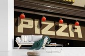Behang - Fotobehang Pizza restaurant uithangbord - Breedte 600 cm x hoogte 400 cm
