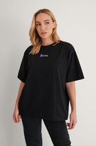 NA-KD Karma Printed Dames T-shirt - Maat M
