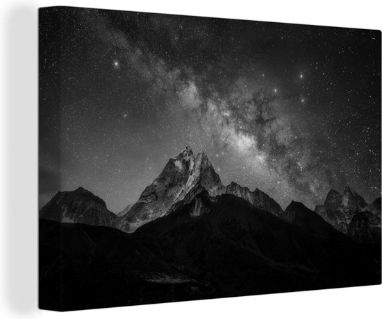 Canvas Schilderij Een indrukwekkende Melkweg zichtbaar in de nacht - zwart wit - 120x80 cm - Wanddecoratie
