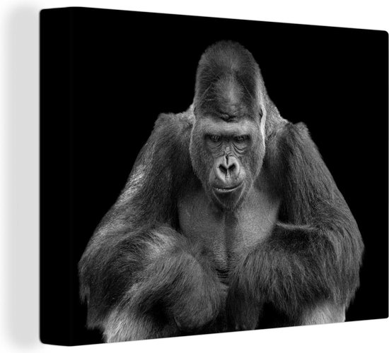 Canvas Schilderij Een Gorilla kijkt indrukwekkend in de camera - zwart wit - Wanddecoratie