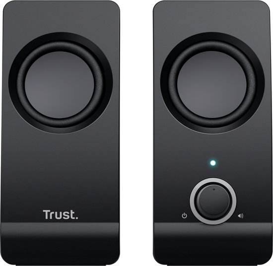 Twee compacte zwarte Trust speakers met ronde speakers en een volumeknop op de rechter unit.