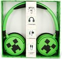 Groene Minecraft draadloze koptelefoon met Creeper-print, in de verpakking, met afbeeldingen van accessoires.