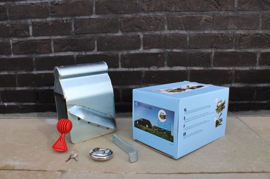 Novio antidiefstal set met disselslot, rood handvat, slot en sleutels naast de doos.