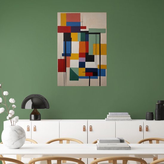 Œuvre d'art abstraite avec des formes géométriques dans des tons de rouge, bleu, jaune et vert, suspendue au-dessus d'une commode blanche.