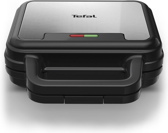 Gesloten Tefal wafelijzer met zilverkleurig deksel en zwarte behuizing. Indicatielampjes rood en groen.