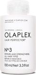 Witte fles Olaplex Hair Perfector No.3 met een fliptopdop. Tekst op de fles: 'TAKE HOME OLAPLEX.COM THE ORIGINAL L'ORIGINAL OLAPLEX HAIR PERFECTOR N°.3 REPAIRS AND STRENGTHENS ALL HAIR TYPES RÉPARE ET RENFORCE TOUS LES TYPES DE CHEVEUX'.