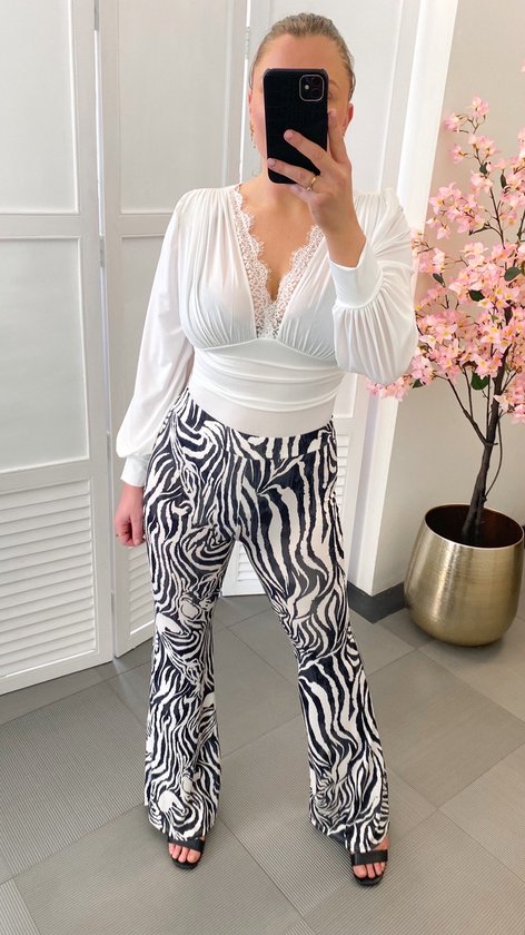 Broek met zebra print - Zwart/wit - Flare pants met dierenprint - Legging met stretch - Festival kleding voor vrouwen - Festival outfit voor dames - One-size - Een maat