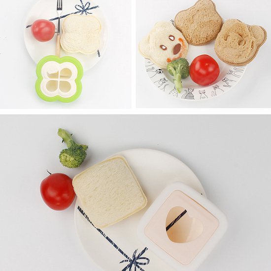 Un emporte-pièce à pain vert et rond avec un motif d'étoile, une tomate et un morceau de pain sur une assiette.