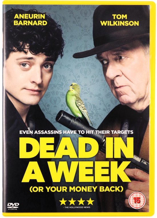 Twee mannen, één met een hoed, staan naast elkaar met een parkiet op een pistool. "DEAD IN A WEEK" is groot gedrukt.