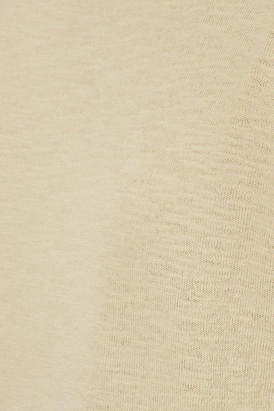 Gros plan sur la texture d'un tissu beige.
