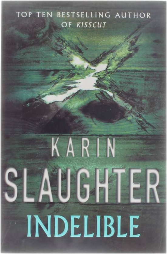Boek 'Indelible' van Karin Slaughter. Een groen houten kruis met een scheur erin. Top Tien Bestseller.