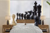 Behang - Fotobehang Zwart wint met schaken - Breedte 350 cm x hoogte 350 cm
