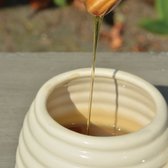 Pot de miel avec cuillère en bois
