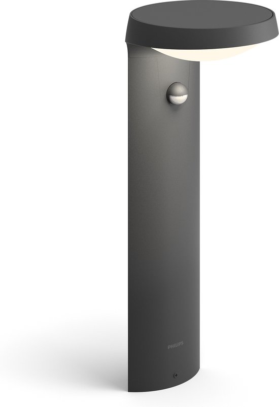 Antracietkleurige Philips sokkellamp met bewegingssensor en gebogen lampenkap, op witte achtergrond.