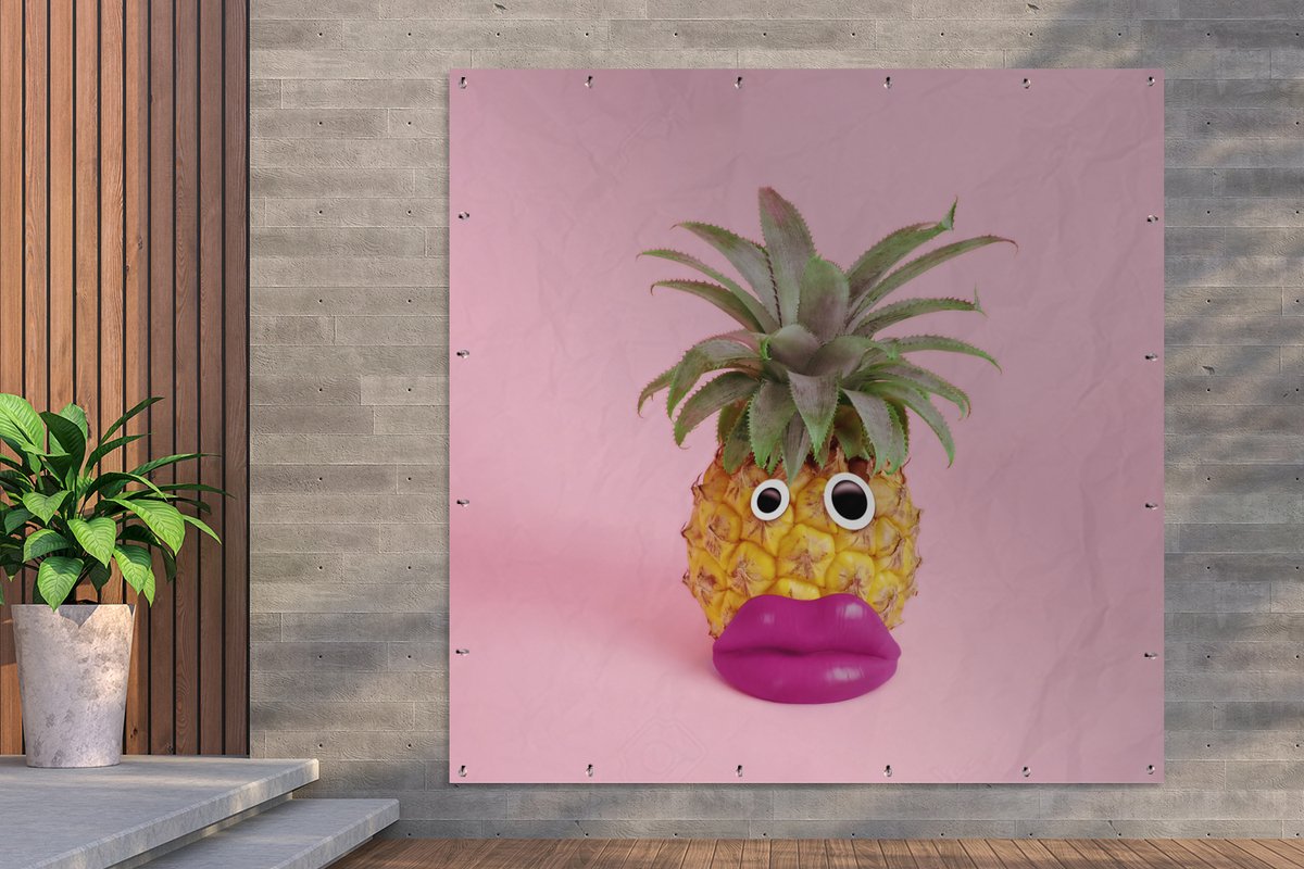 pineapple with face made of fake lips and googly eyes