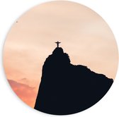 WallClassics - PVC Schuimplaat Muurcirkel - Silhouet van Jezusbeeld op berg met Zonsondergang - 90x90 cm Foto op Muurcirkel (met ophangsysteem)