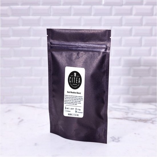 Zwarte papieren zak met Citea 'Bad Weather Blend' label, met zilveren sluiting bovenaan.