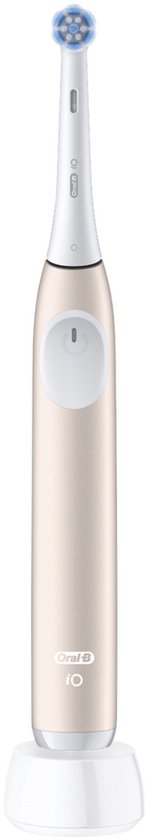 Beige Oral-B iO elektrische tandenborstel op een witte oplader.