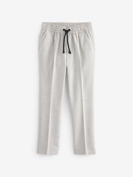 Lichtgrijze pantalon met elastische tailleband, trekkoord en steekzakken.