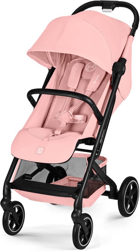 Poussette rose Cybex Beezy, légèrement de trois-quarts avant, avec capote et harnais.