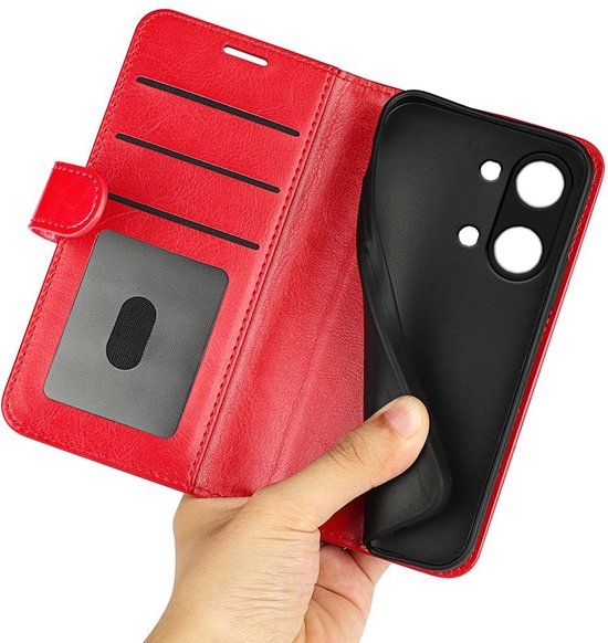 Rood wallet book case met kaarthouders, één hand toont een zwarte TPU hoes.