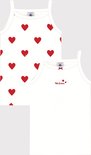 Twee witte topjes, één met rode hartjesprint en 'Petit Bateau' opschrift, de ander effen.