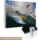 MuchoWow® Glasschilderij 60x40 cm - Schilderij acrylglas - Alpen - Paragliding - Sneeuw - Foto op glas - Schilderijen