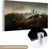 MuchoWow® Glasschilderij 40x20 cm - Schilderij acrylglas - Uitzicht op de mistige San Gimignano in Italië - Foto op glas - Schilderijen